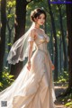 A woman in a wedding dress standing in the woods.